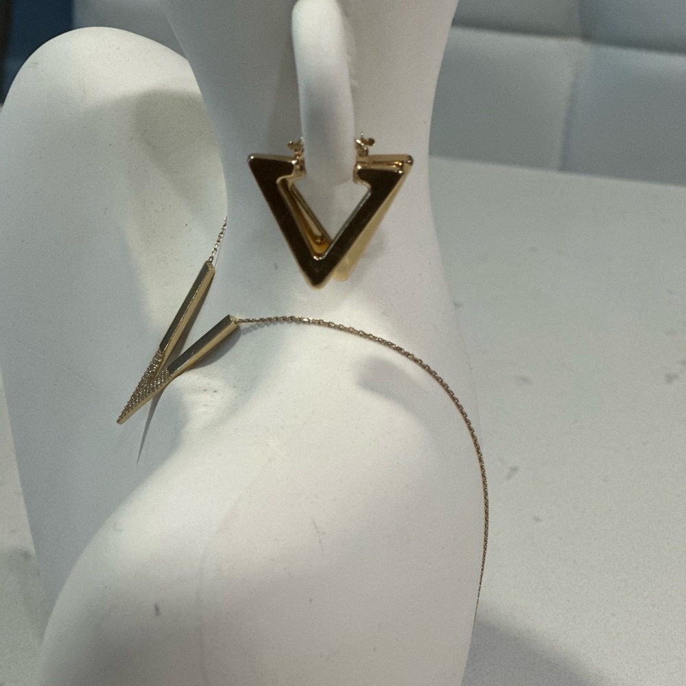 A pair of 14k gold earrings in the shape of a triangle, real gold!